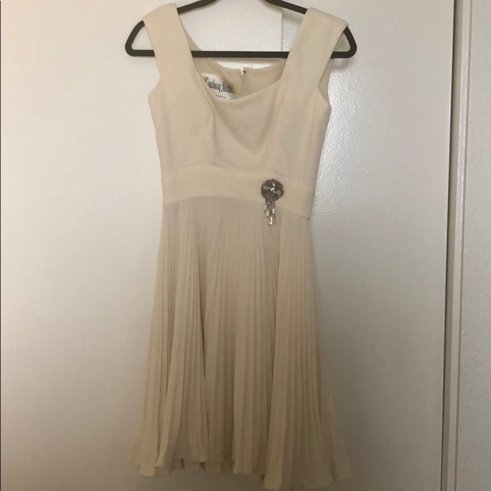A true 60s vintage white ruffled dress